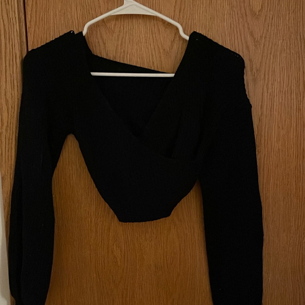 black cute sweater with a v neck cross cross